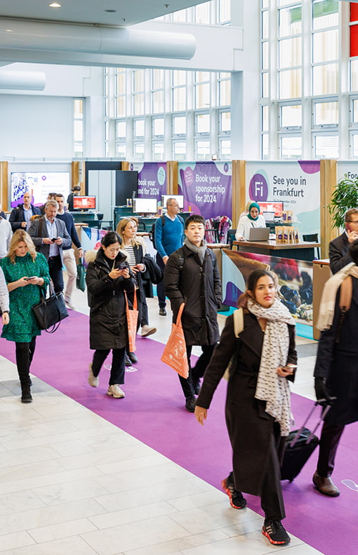 Visitors walking by at Fi Europe