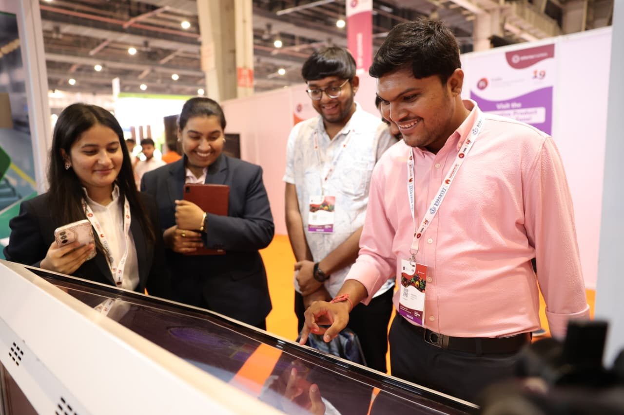 Visitors listening to exhibitor